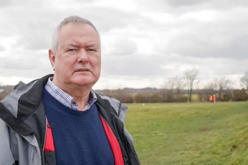 Liberal Democrat campaigner Malcolm Bond at the site where new houses are being built next to South Bents estate