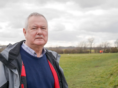 Liberal Democrat campaigner Malcolm Bond at the site where new houses are being built next to South Bents estate