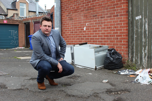 Lib Dem councillor Martin Haswell with dumped rubbish in Pallion