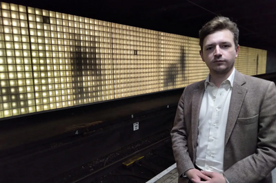 Niall Hodson in front of the Platform 5 artwork at Sunderland railway station